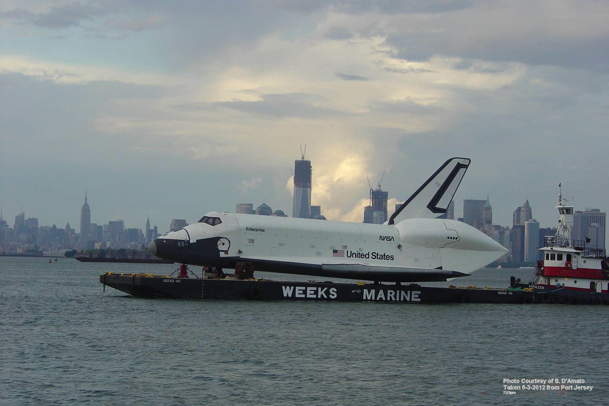 Enterprise with Freedom Tower in the background